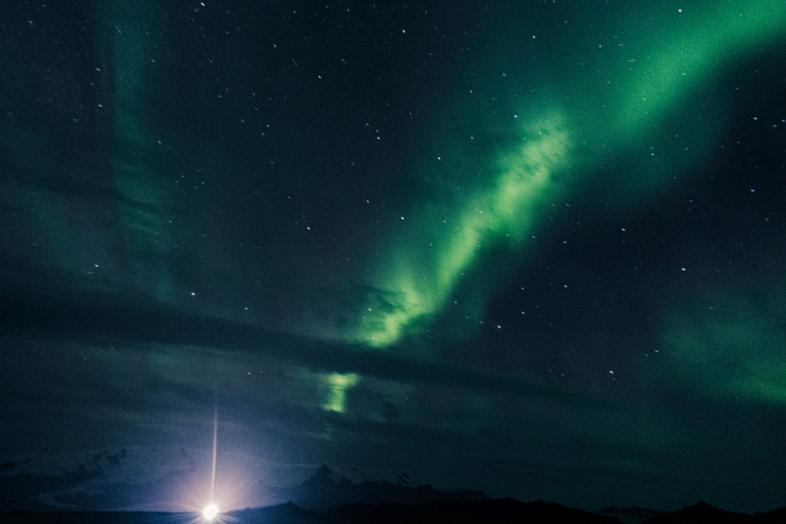 Strange light emitted from glacier—any ideas what this could be? post thumbnail image